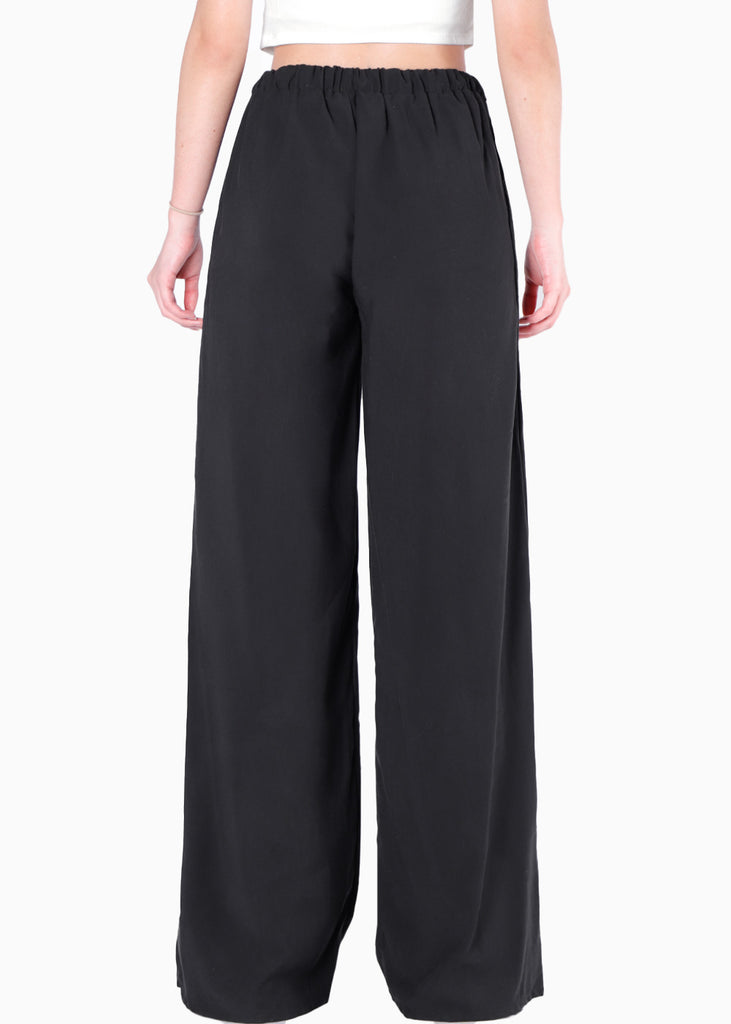 Pantalón wide leg con elástico en cintura y anudado color negro para mujer - Flashy